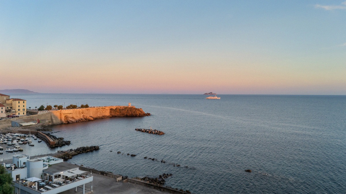 The port of Piombino with a ferry leaving for Elba
